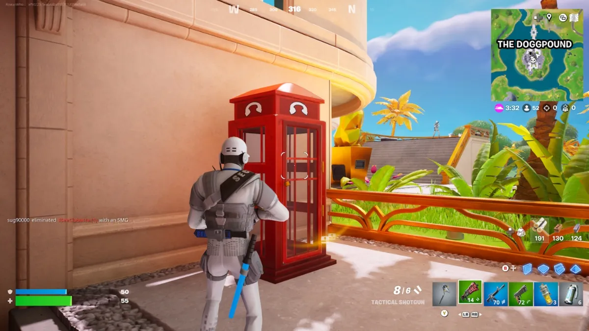 a player in a Ghost Henchman disguise looks at a red phone box